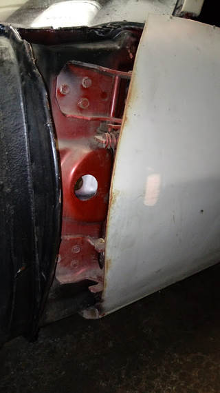 A peek inside the door jamb reveals the FACTORY SILVER color of my car